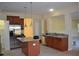Kitchen with granite counters, island and stainless steel appliances at 20420 Carolina Cherry Ct, Tampa, FL 33647