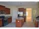 Kitchen with granite counters, island and stainless steel appliances at 20420 Carolina Cherry Ct, Tampa, FL 33647