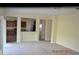 Open-concept living room with neutral decor and seamless flow into the kitchen area at 20420 Carolina Cherry Ct, Tampa, FL 33647