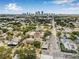 Aerial view of the neighborhood featuring lush trees, houses, and the city skyline at 215 S Westland Ave # 3, Tampa, FL 33606