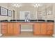 Bathroom featuring double sinks, granite countertops, ample cabinetry, and neutral tile flooring at 215 S Westland Ave # 3, Tampa, FL 33606