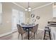 Cozy dining area with stylish table and chairs, complemented by a view of the bright kitchen at 215 S Westland Ave # 3, Tampa, FL 33606