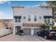 Charming two-story home with a red tiled roof, gray siding, and a two-car garage at 215 S Westland Ave # 3, Tampa, FL 33606
