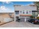 Modern two-story townhome featuring a red tile roof and attached two-car garage at 215 S Westland Ave # 3, Tampa, FL 33606