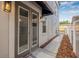 Side view featuring back entrance, covered window, and manicured landscape at 215 S Westland Ave # 3, Tampa, FL 33606