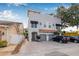 A well-maintained two-story exterior showcases a modern design with a brick driveway and individual garage doors at 215 S Westland Ave # 3, Tampa, FL 33606