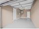 Spacious two-car garage featuring a sealed concrete floor and plenty of storage space at 215 S Westland Ave # 3, Tampa, FL 33606