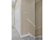 Hallway with gray carpeting, white trim, and a view of the stairs and closet at 215 S Westland Ave # 3, Tampa, FL 33606