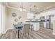 Well-lit dining area adjacent to a modern kitchen with stainless steel appliances and bar stool seating at 215 S Westland Ave # 3, Tampa, FL 33606
