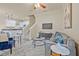Bright living room boasts stylish décor, open floor plan, ceiling fan and gray floors at 215 S Westland Ave # 3, Tampa, FL 33606