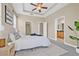 Large main bedroom with ceiling fan, tray ceiling, and ensuite bathroom with a walk-in closet at 215 S Westland Ave # 3, Tampa, FL 33606