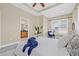 Spacious main bedroom boasts tray ceiling, neutral walls, large windows, and ensuite bathroom access at 215 S Westland Ave # 3, Tampa, FL 33606
