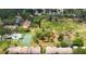 Aerial view of the community featuring pool, tennis court, and green space at 2355 Bentley Dr, Palm Harbor, FL 34684