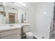 Bright bathroom featuring a shower with white subway tile surround and a single sink vanity at 2355 Bentley Dr, Palm Harbor, FL 34684