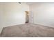 Cozy bedroom featuring plush carpet, a ceiling fan, and a closet leading to another room at 2355 Bentley Dr, Palm Harbor, FL 34684