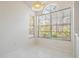 Breakfast nook with tile flooring and large windows for natural light at 2355 Bentley Dr, Palm Harbor, FL 34684
