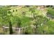 Aerial view of a community park with walking paths and mature trees at 2355 Bentley Dr, Palm Harbor, FL 34684