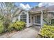 Charming home featuring a well-manicured front yard with beautiful landscaping and a welcoming entrance at 2355 Bentley Dr, Palm Harbor, FL 34684