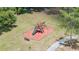 A playground with swings, a slide, and a bench in a well-kept community park at 2355 Bentley Dr, Palm Harbor, FL 34684