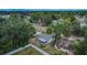 Aerial shot of a home with a fenced backyard and a screened patio at 2415 Devonwoode Pl, Seffner, FL 33584