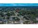 An aerial view showcasing a quiet, tree-lined neighborhood with well-kept homes at 2415 Devonwoode Pl, Seffner, FL 33584