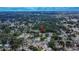 Aerial view shows an established neighborhood close to local lakes with mature trees and quiet streets at 2415 Devonwoode Pl, Seffner, FL 33584