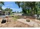 A large back yard featuring a screened-in patio and landscaping at 2415 Devonwoode Pl, Seffner, FL 33584