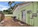 Backyard featuring the home's exterior, utilities, and a fenced yard at 2415 Devonwoode Pl, Seffner, FL 33584