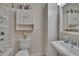 Close-up of the updated bathroom with stylish cabinets, a sink, and a shower/tub combination at 2415 Devonwoode Pl, Seffner, FL 33584