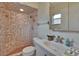 Well-maintained bathroom featuring a shower with tile surround, complemented by updated sink at 2415 Devonwoode Pl, Seffner, FL 33584