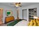 Bedroom features stylish decor, with ceiling fan, closet space and ensuite bathroom at 2415 Devonwoode Pl, Seffner, FL 33584