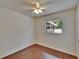 Well lit bedroom features wood floors and fan at 2415 Devonwoode Pl, Seffner, FL 33584