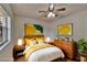 Bedroom staged with decor, bed, lamps, and nightstands at 2415 Devonwoode Pl, Seffner, FL 33584