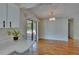 Bright dining area featuring hardwood floors, a chandelier, and sliding doors to the patio at 2415 Devonwoode Pl, Seffner, FL 33584