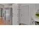 Bright kitchen featuring stainless steel refrigerator, and access to the entry door at 2415 Devonwoode Pl, Seffner, FL 33584