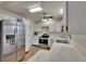 Bright kitchen with stainless steel refrigerator, modern appliances, and ample countertop space at 2415 Devonwoode Pl, Seffner, FL 33584