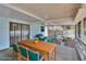 Large screened patio featuring a dining table and wicker furniture for outdoor enjoyment and relaxation at 2415 Devonwoode Pl, Seffner, FL 33584