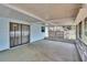 Spacious screened patio with concrete floor and access to the backyard, perfect for outdoor living at 2415 Devonwoode Pl, Seffner, FL 33584