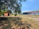 Spacious backyard featuring a shed and room to relax or entertain at 2432 Caretta Ave, Spring Hill, FL 34609