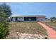 Backyard featuring a screen porch, walkway, and large yard at 2432 Caretta Ave, Spring Hill, FL 34609