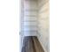 Walk-in closet with wire shelving and modern flooring at 2432 Caretta Ave, Spring Hill, FL 34609