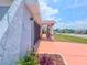Exterior shot reveals well-maintained landscaping and colorful accents at 2432 Caretta Ave, Spring Hill, FL 34609