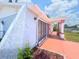 Exterior shot reveals well-maintained landscaping and colorful accents at 2432 Caretta Ave, Spring Hill, FL 34609