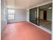 View of a room with a screened patio and view of backyard at 2432 Caretta Ave, Spring Hill, FL 34609