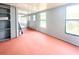 View of a room with a screened patio and view of backyard at 2432 Caretta Ave, Spring Hill, FL 34609