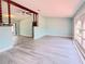 Bright and airy living room with stylish ceiling fan, accent wall, and modern flooring at 2432 Caretta Ave, Spring Hill, FL 34609