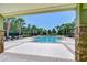 Relaxing community pool area with comfortable lounge chairs and palm trees at 2723 Garden Falls Dr, Brandon, FL 33511