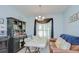 Bright dining area with stylish furnishings, a window, and an adjacent cabinet at 2723 Garden Falls Dr, Brandon, FL 33511