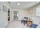 Upstairs hallway with reading nook and access to multiple carpeted bedrooms and ample light at 2723 Garden Falls Dr, Brandon, FL 33511