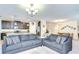 Spacious living room with comfortable seating, connecting to modern kitchen and dining areas at 2723 Garden Falls Dr, Brandon, FL 33511
